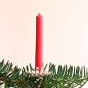 Bendable prongs at base grip the candle and keep it in place.